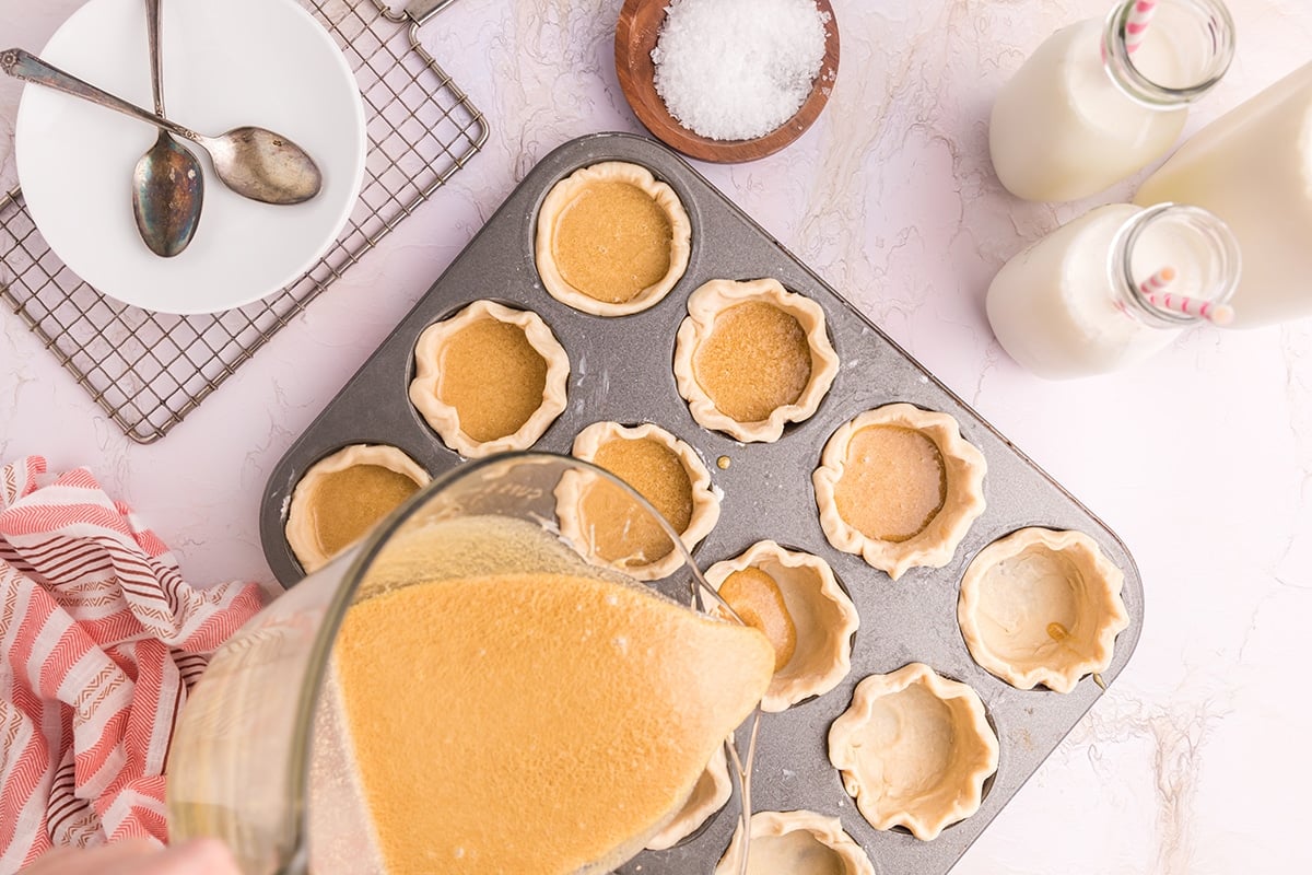 butter tart filling poured into crusts