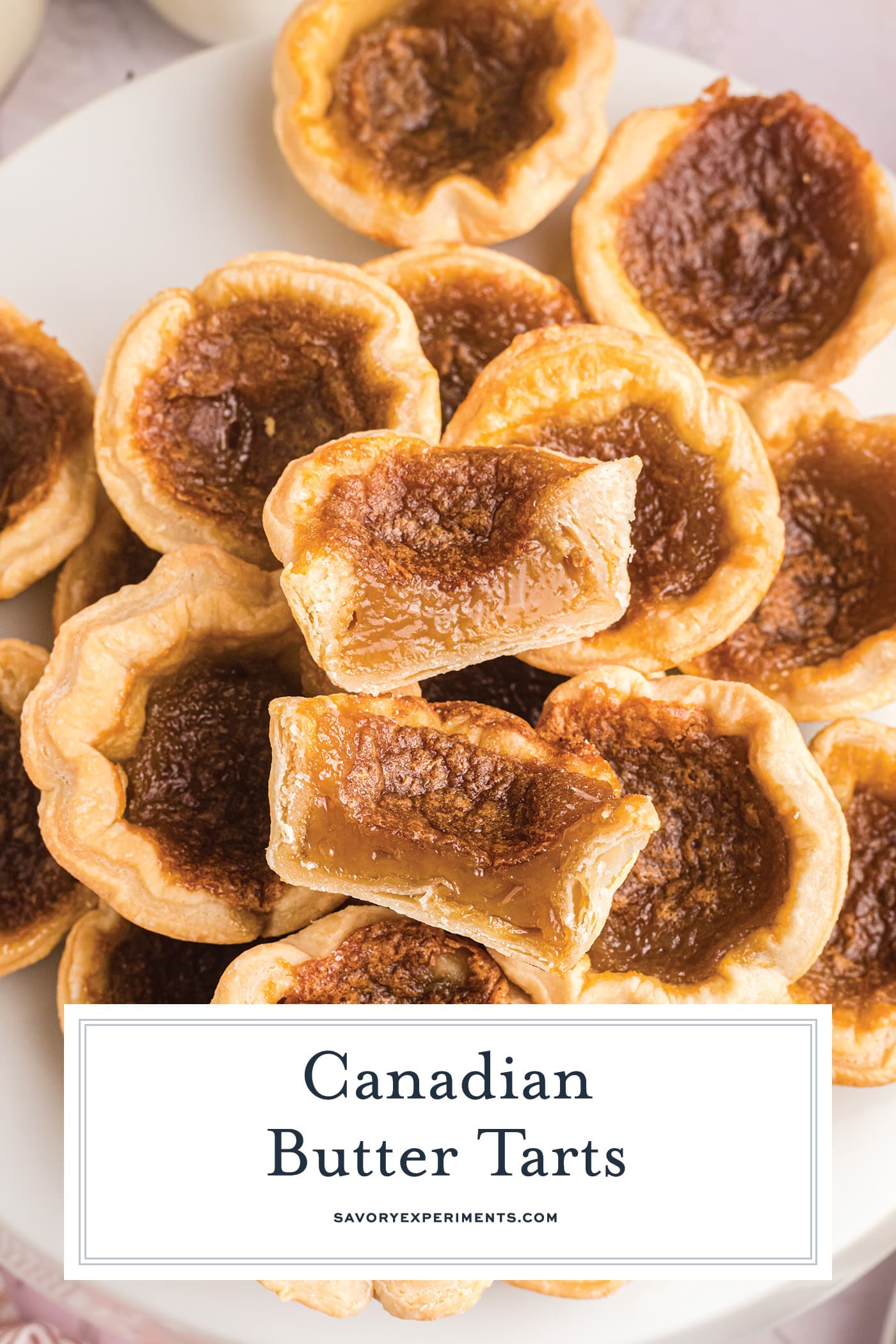 overhead shot of pile of butter tarts with text overlay for pinterest