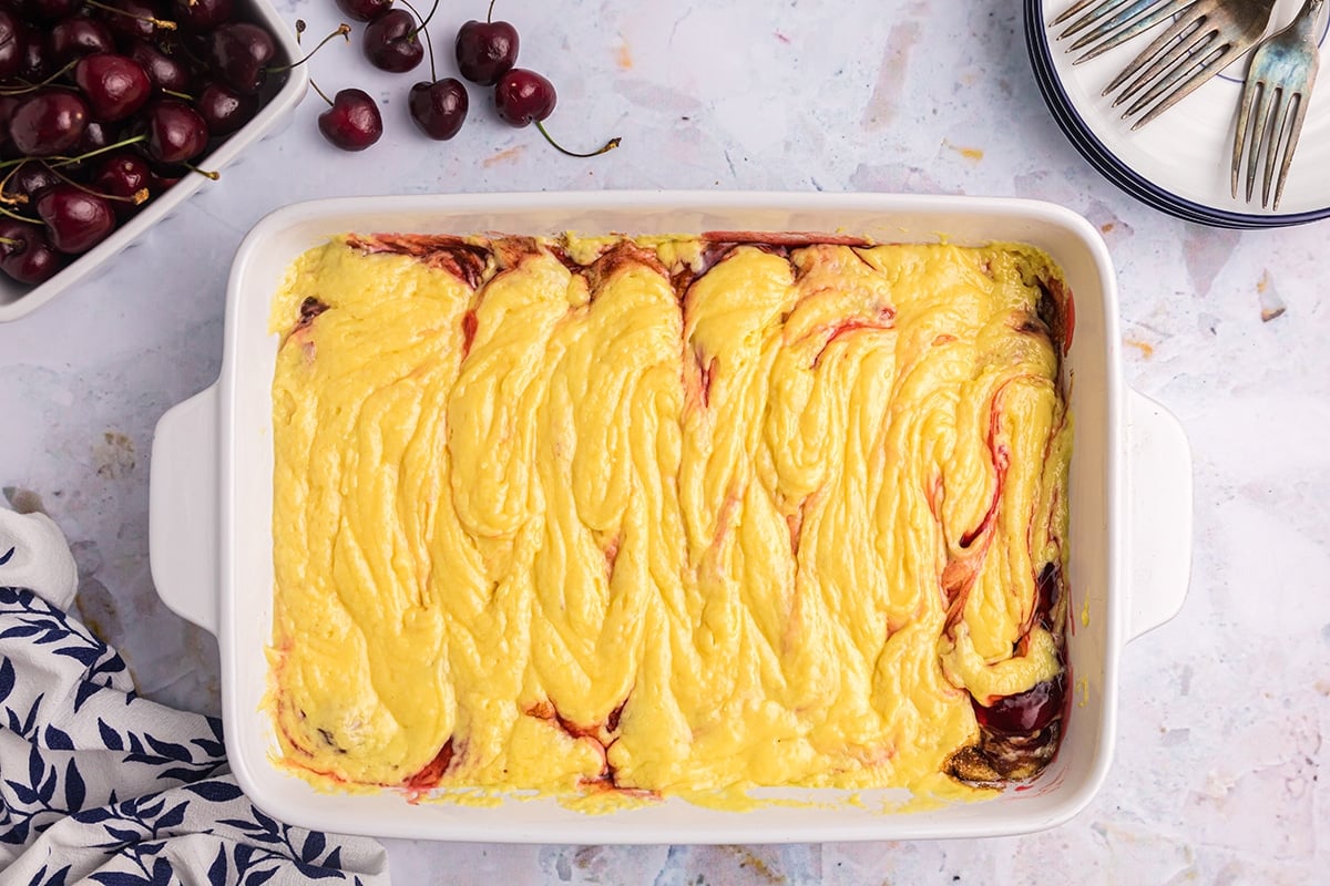 cherry honey bun cake batter in pan