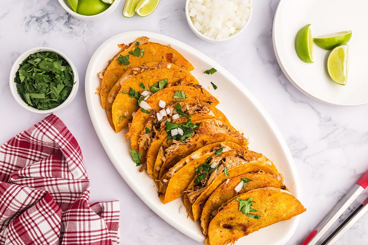 chicken birria tacos on a serving plate