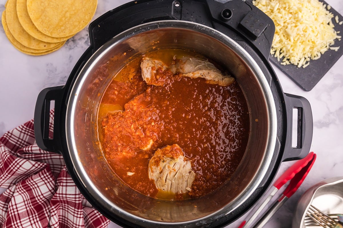 chicken with birria sauce in an instant pot