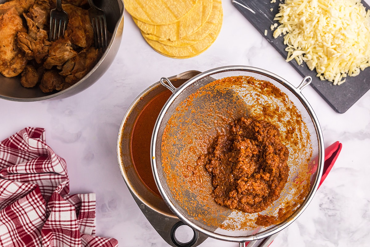 straining birria sauce