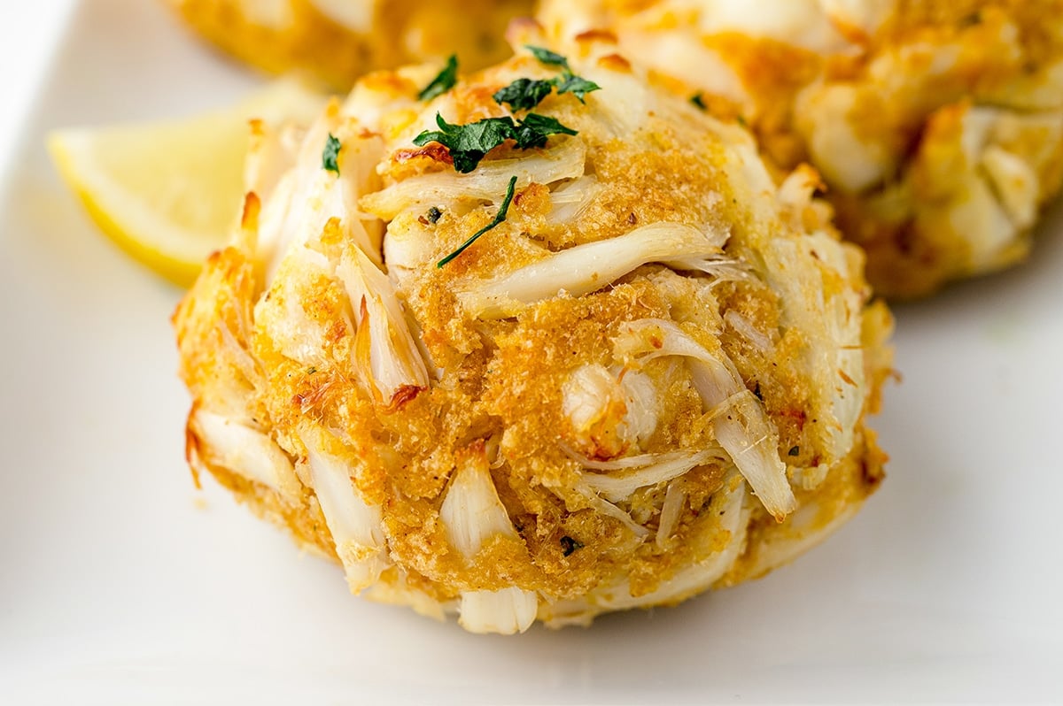 angle view of crab cake on a white plate