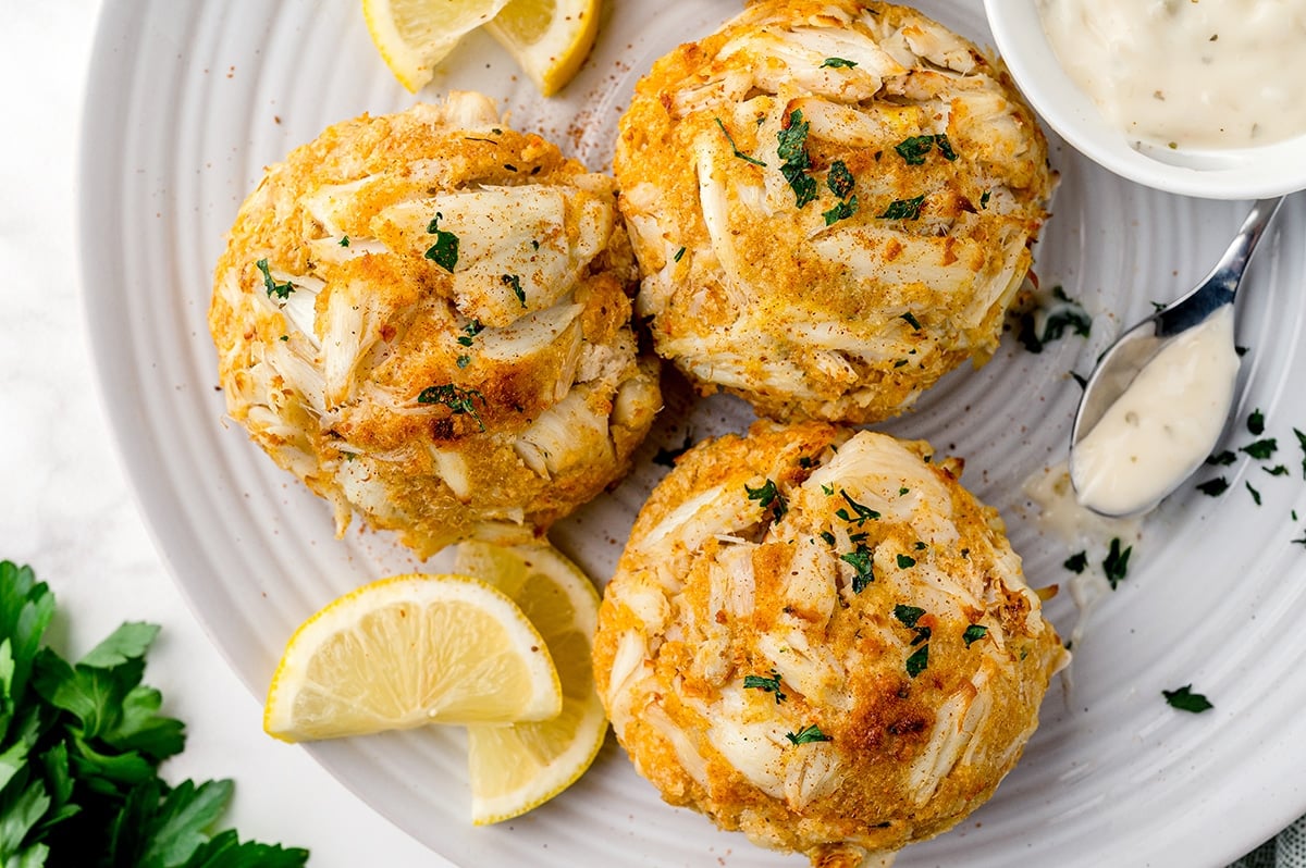 three crabcakes on a serving platter