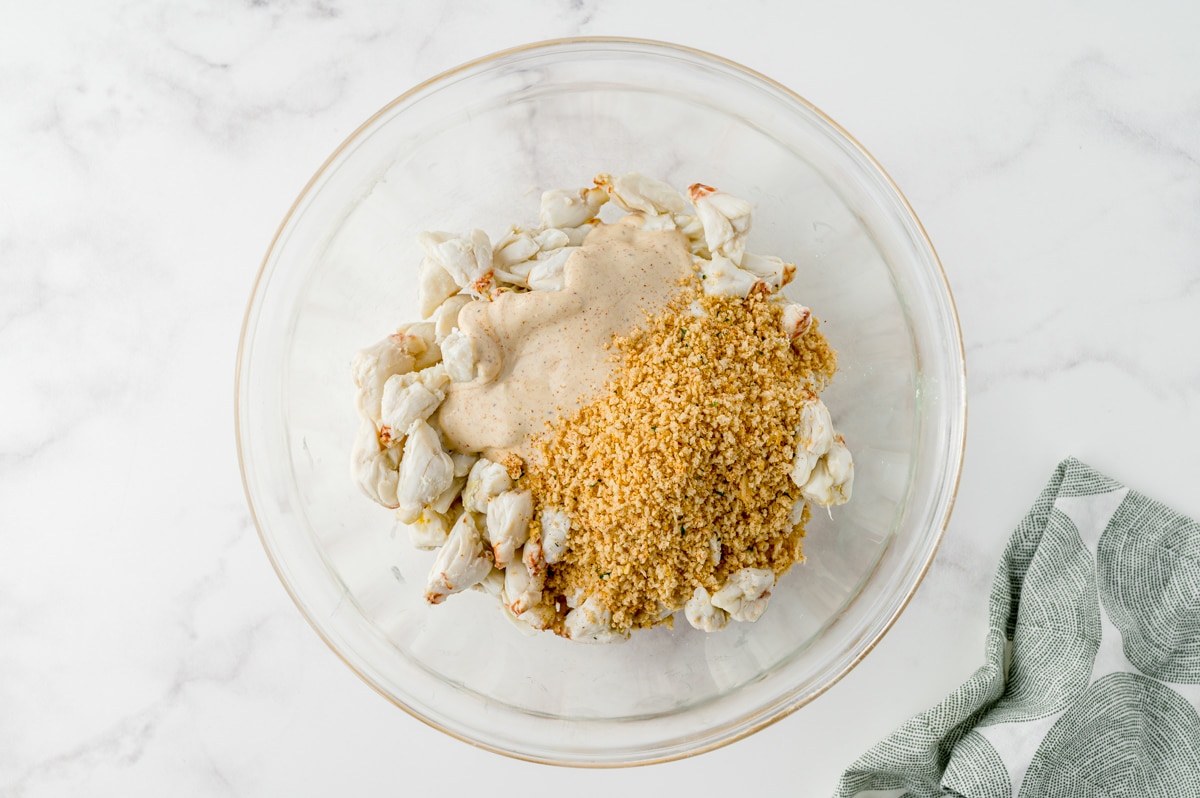 filling for crab cakes in a glass mixing bowl
