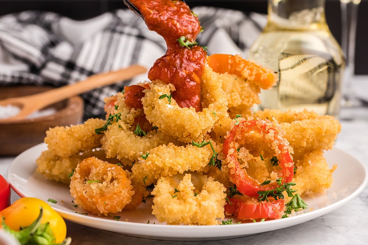 marinara poured onto fried calamari