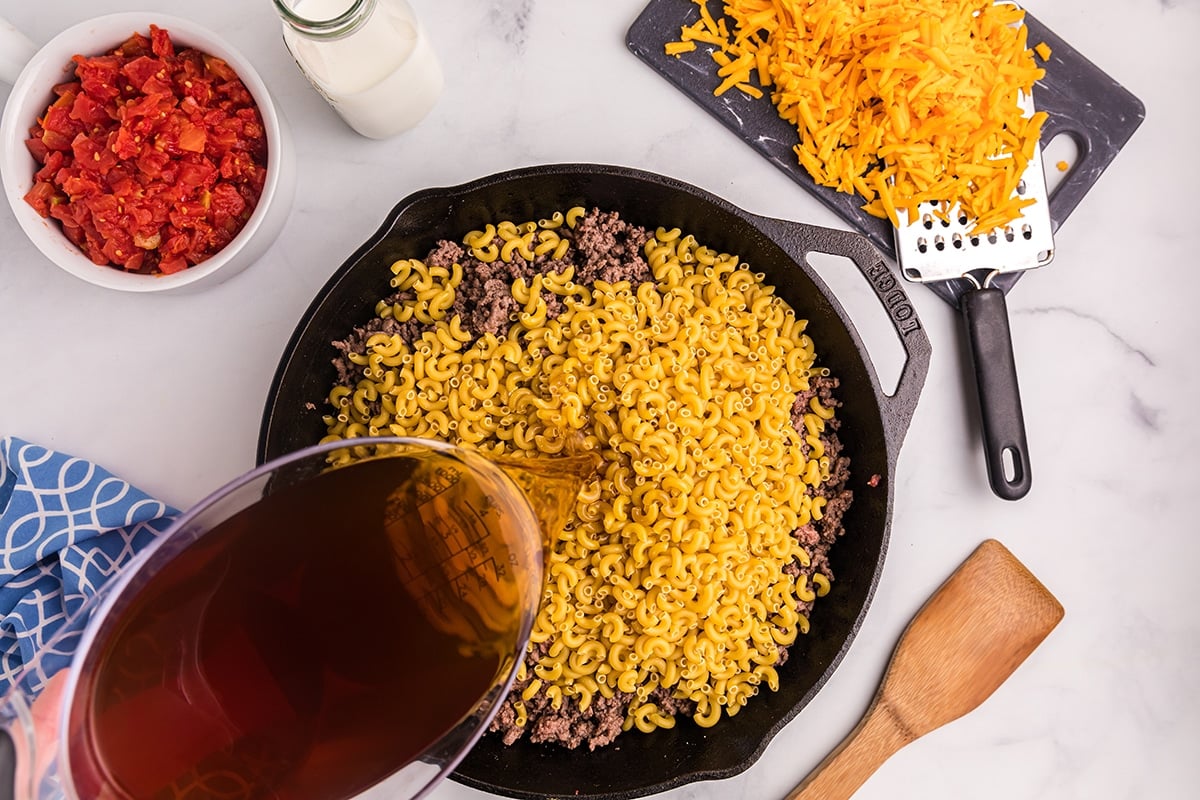 broth poured into macaroni and burger mixture