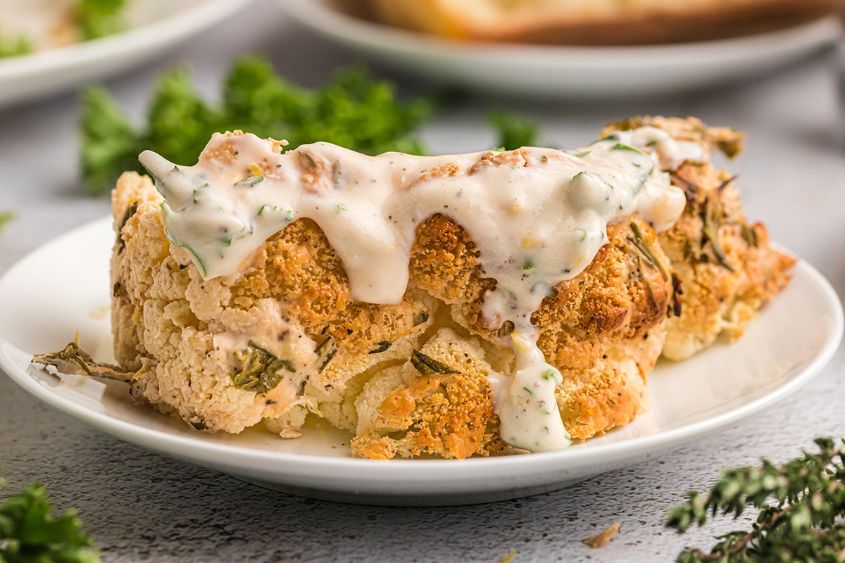 close up of slice of roasted cauliflower on plate