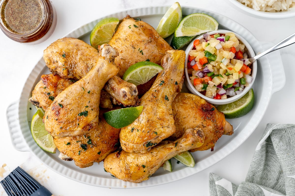 platter of jerk chicken with salsa