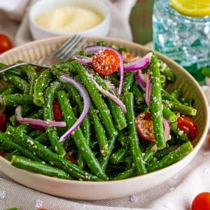 bowl of green bean salad with a fork