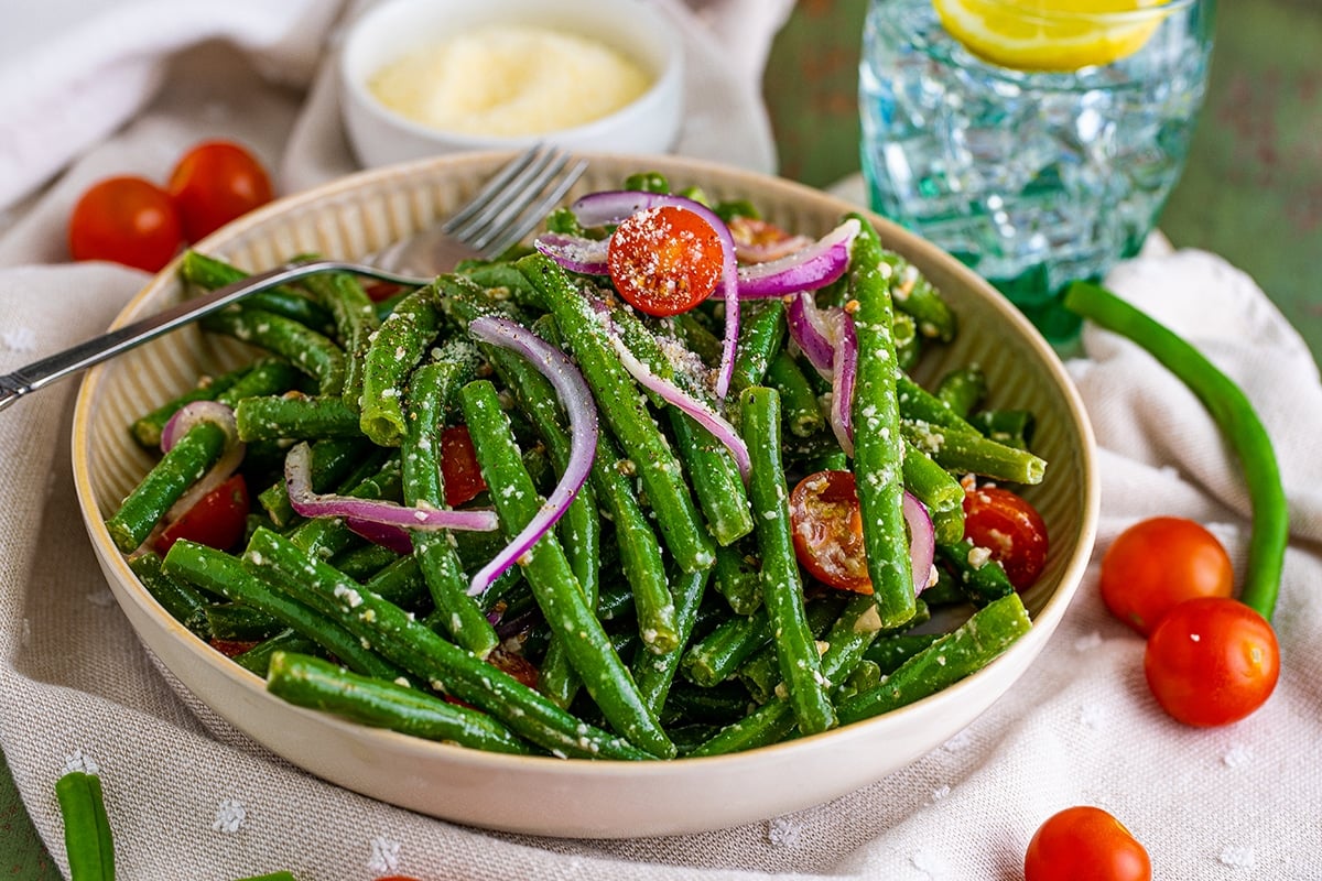 bowl of green bean salad with a fork