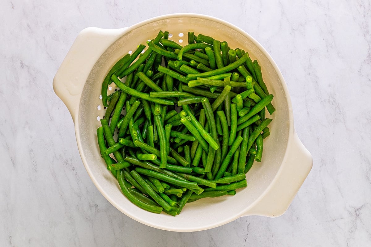 green beans in a strainer