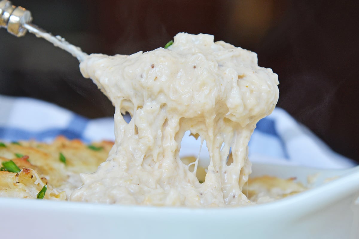 spoon with cheesy crab dip