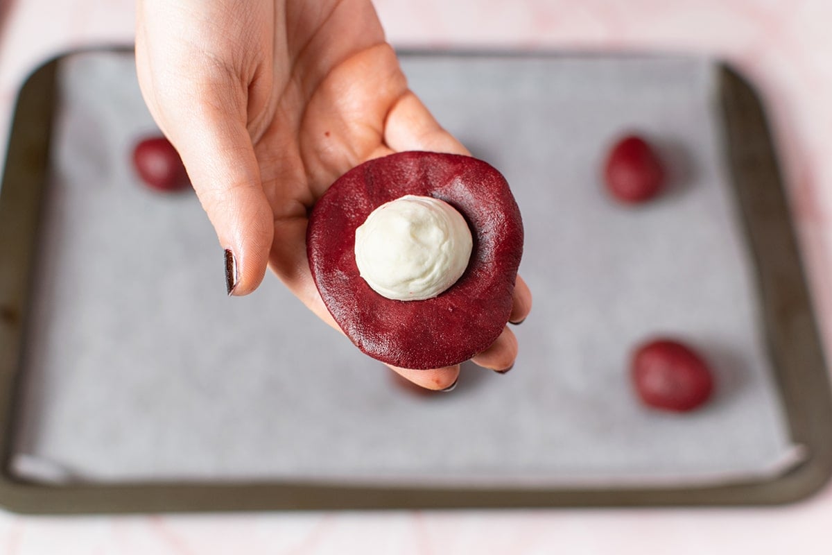 cream cheese filling in red velvet cookie dough