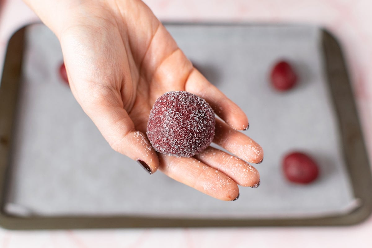 red velvet dough ball in hand