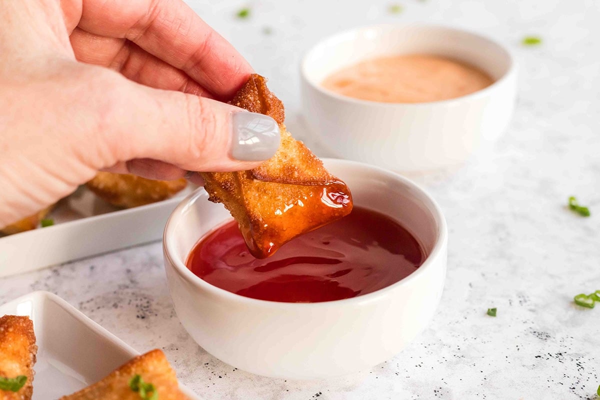 shrimp wonton dipped into red sauce