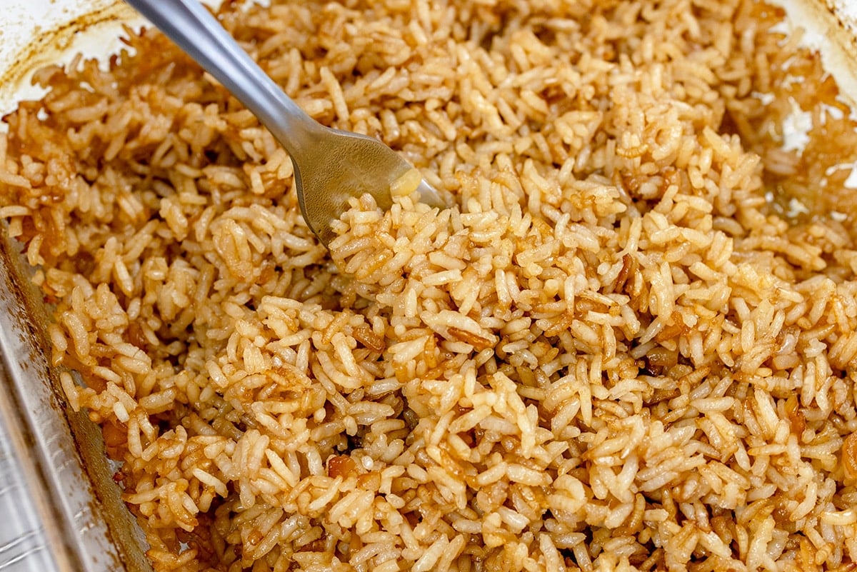 fork fluffing cooked rice