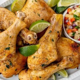 platter of jerk chicken with salsa