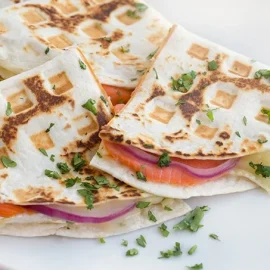 smoked salmon quesadillas on a plate