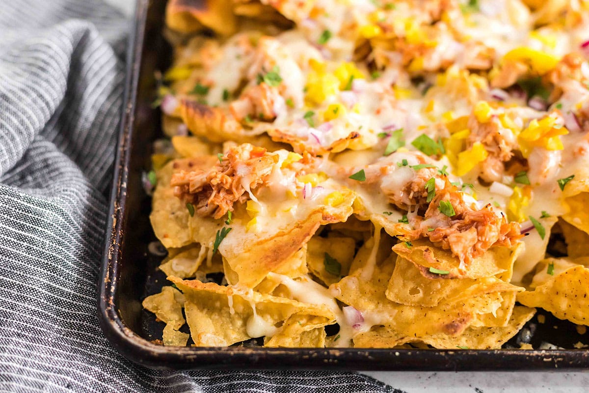 angled shot of close up of bbq chicken nachos