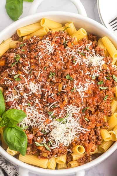 bowl of pasta topped with bolognese sauce