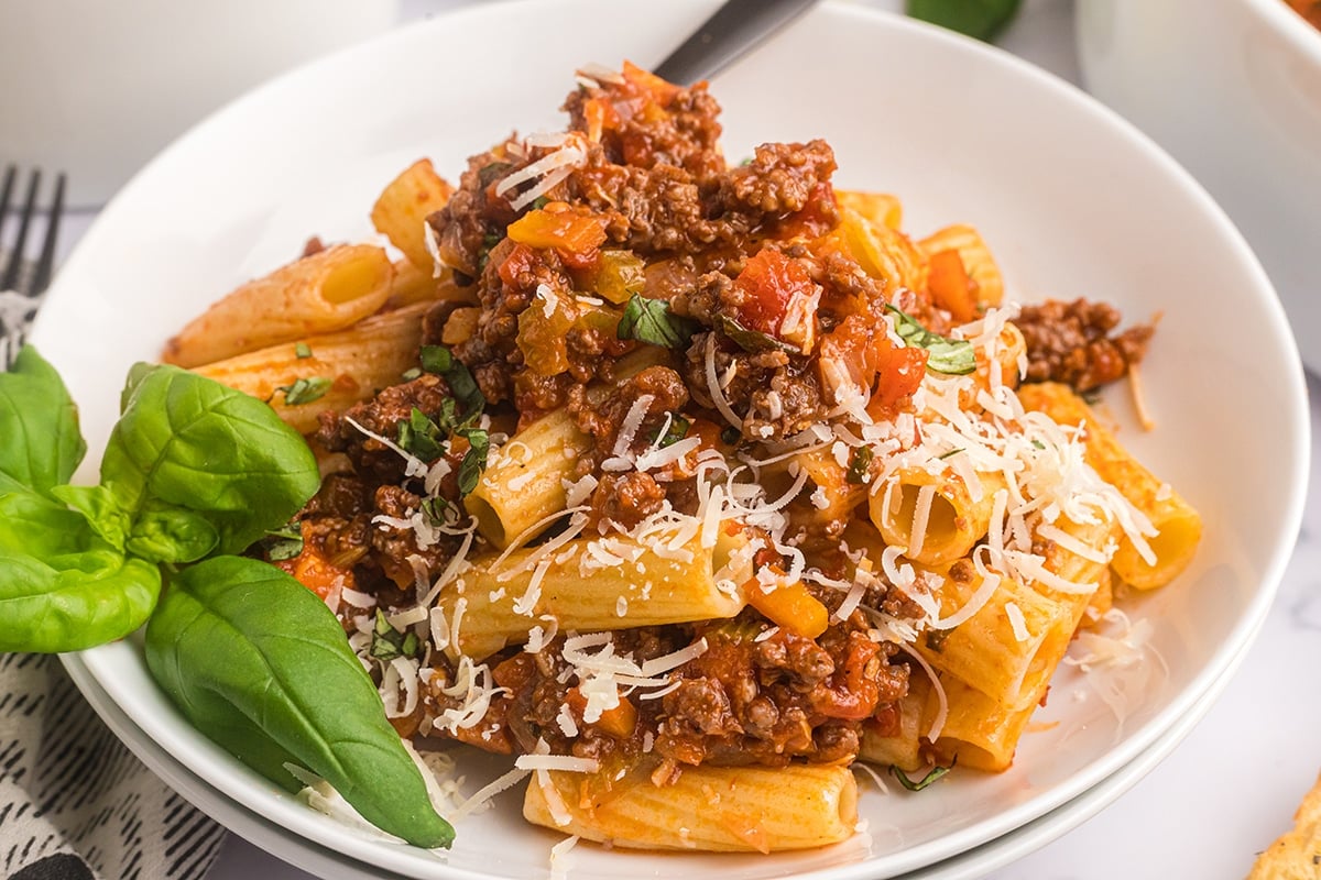 close up of plate of pasta with bolognese