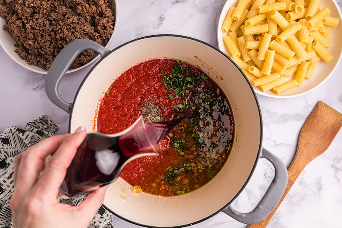 wine poured into sauce ingredients