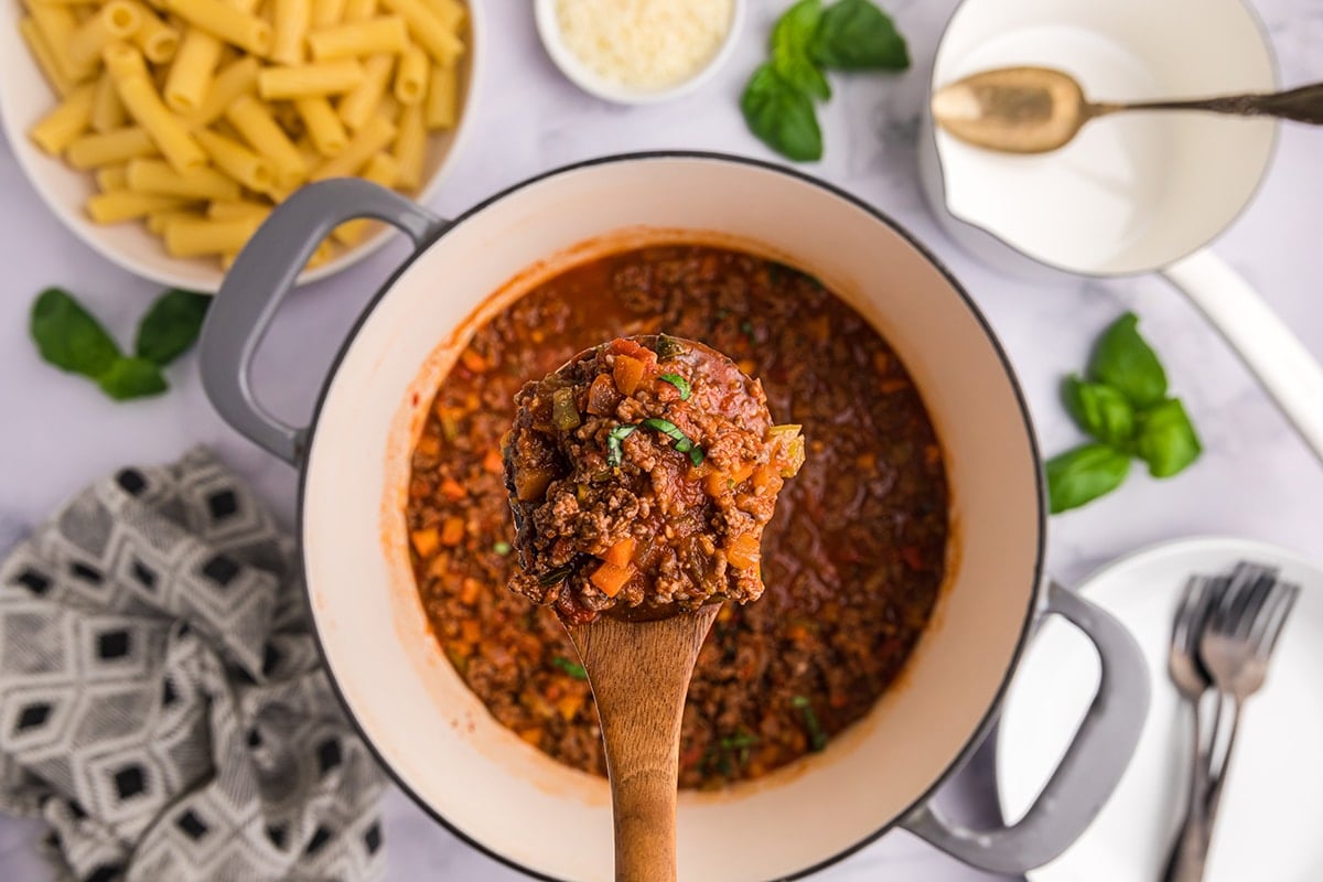 bolognese sauce on a wooden spoon