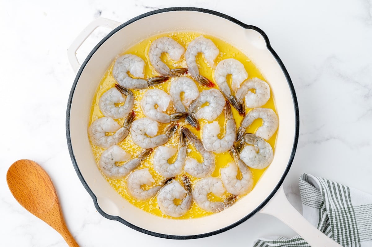 raw shrimp in butter mixture