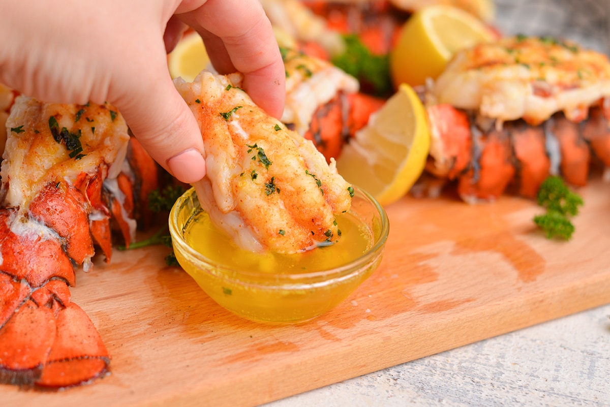 dipping lobster tail in drawn butter