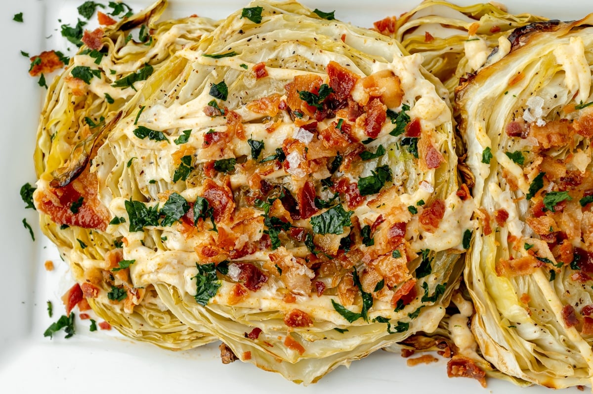 close up of cabbage steaks on a tray