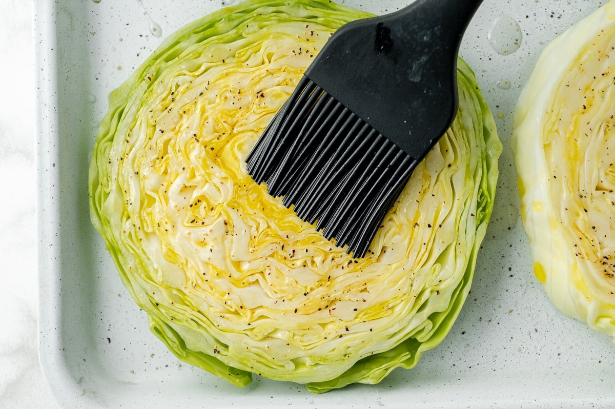 olive oil brushed onto sliced cabbage