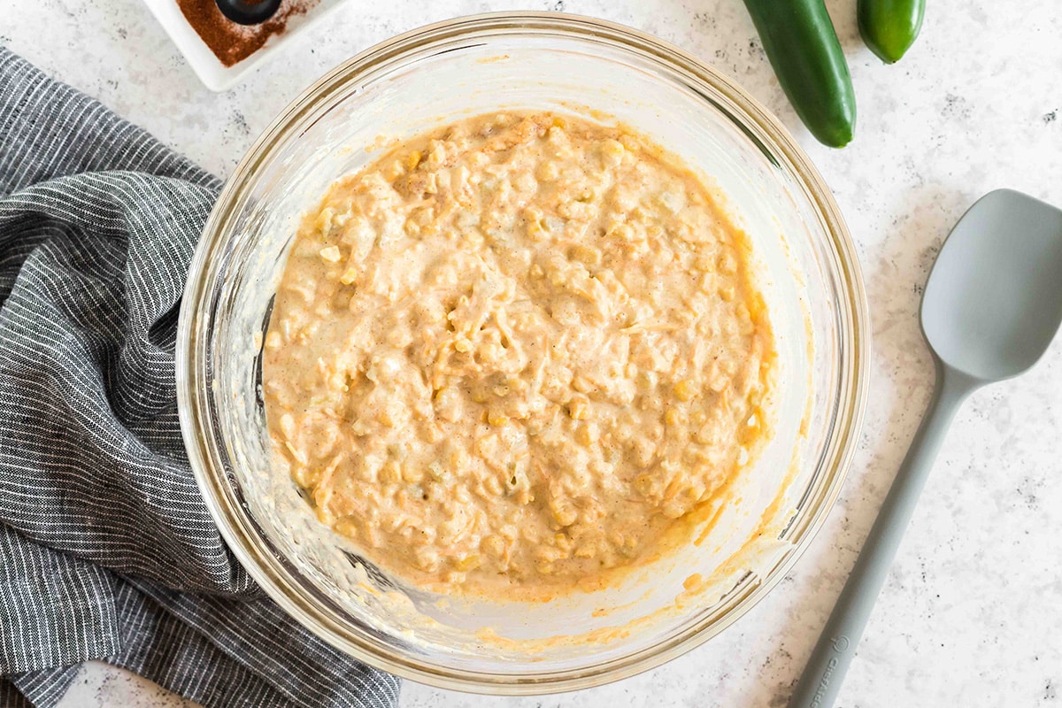 cornbread casserole mixture in a large mixing bowl