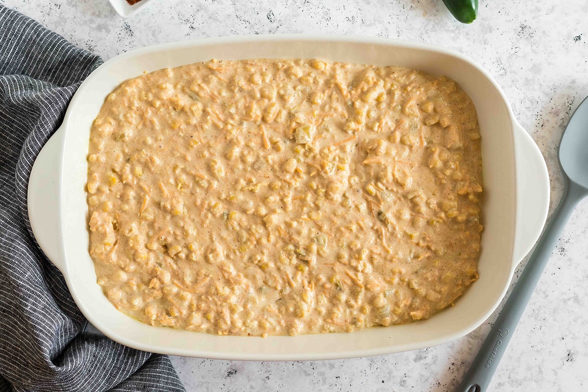 cornbread casserole batter in a casserole dish