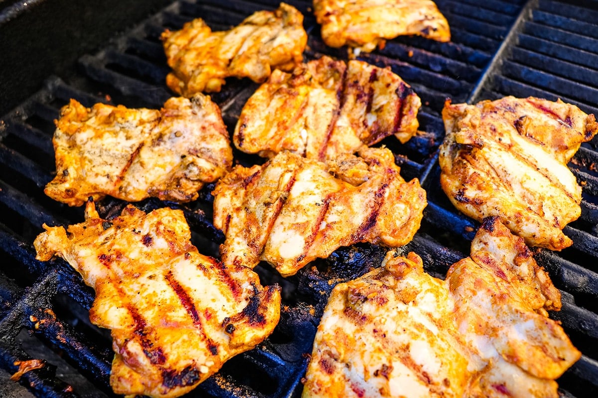 chicken cooking on a grill