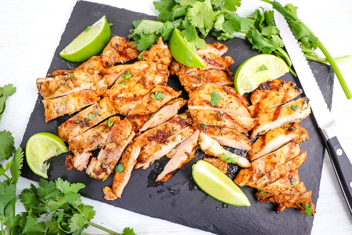 sliced chipotle pollo asado on a platter