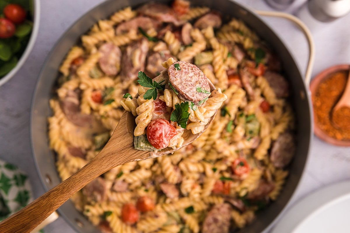 close up of spoon full of creamy cajun pasta