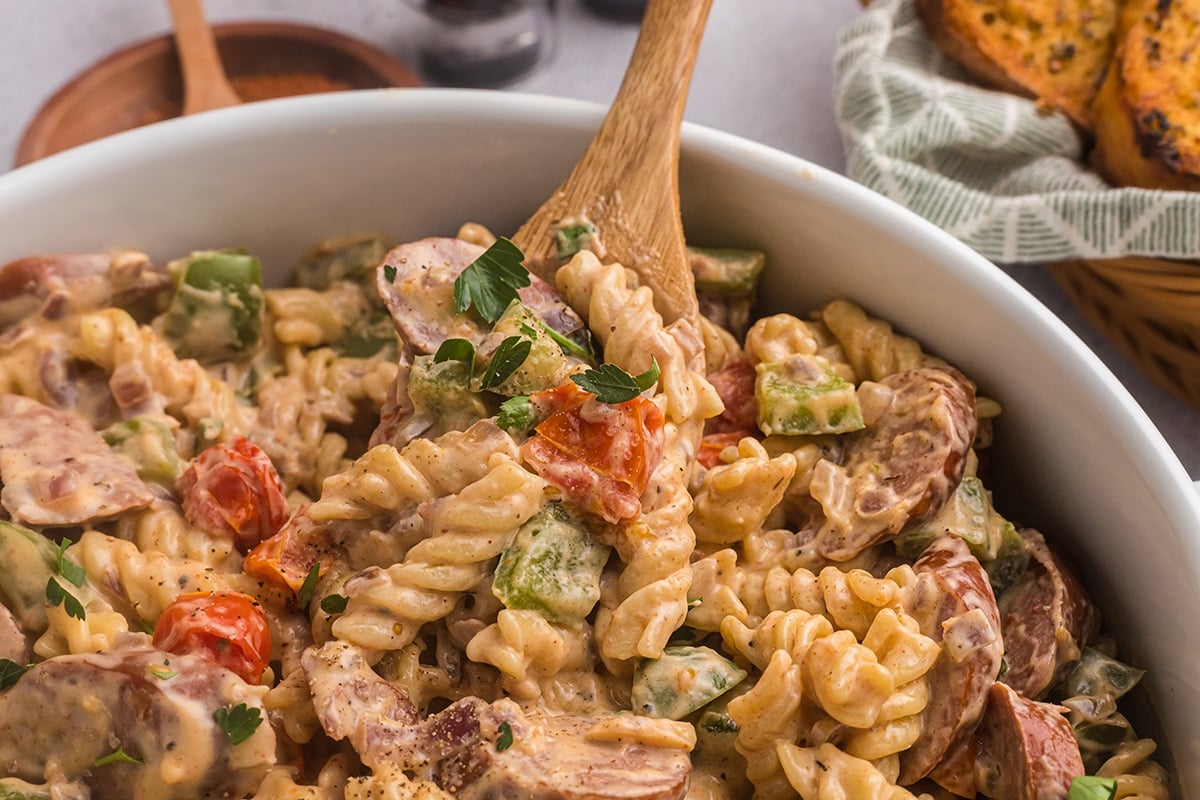 angled shot of wooden spoon in cajun pasta