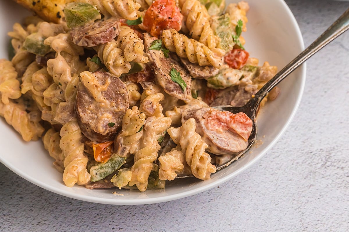 close up of spoon full of creamy cajun pasta