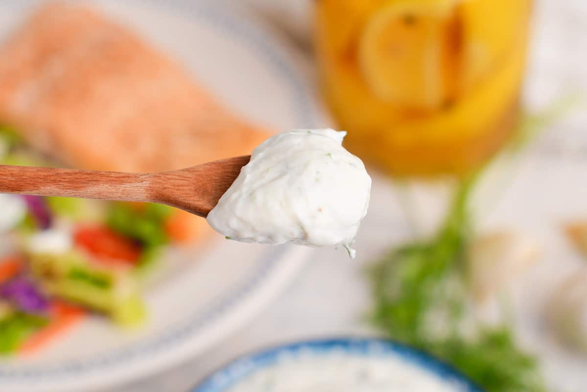 creamy dill sauce on a spoon