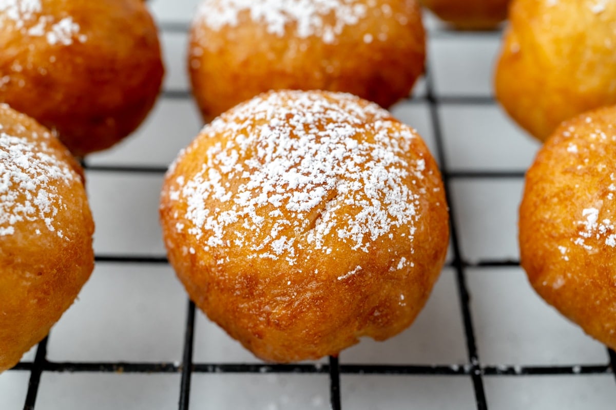 close up of italian fried dough on cooling rack