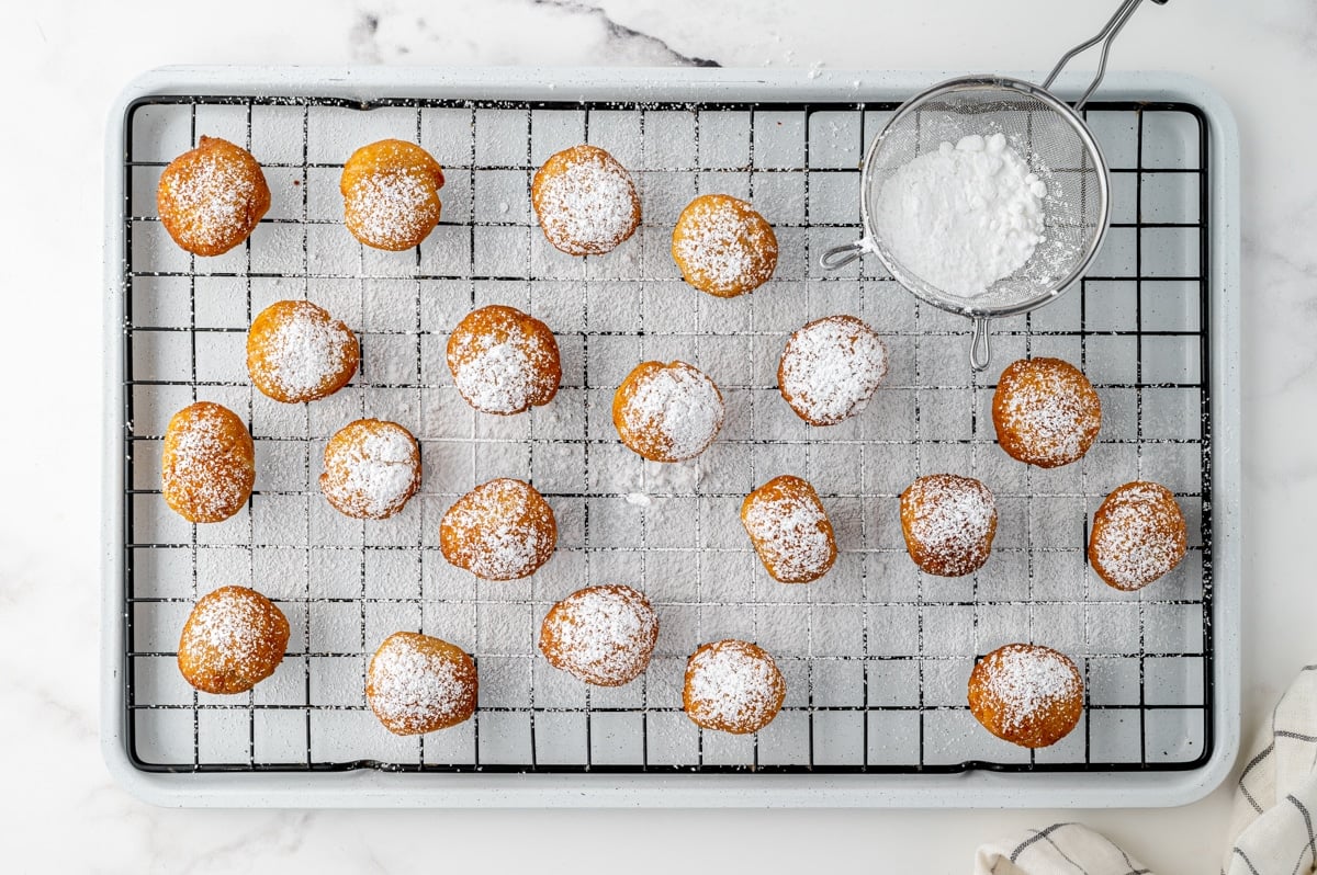 powdered sugar sprinkled on italian fried dough balls