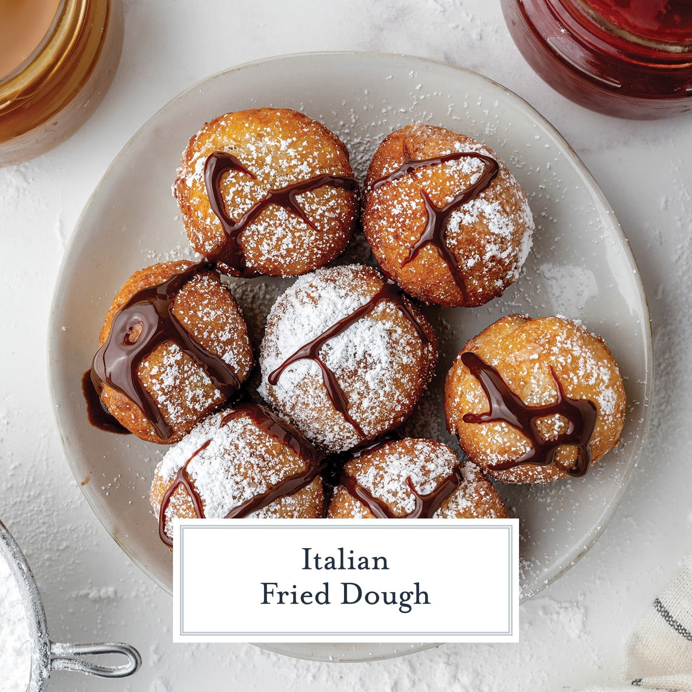 overhead shot of plate of zeppoles drizzled with chocolate with text overlay for facebook