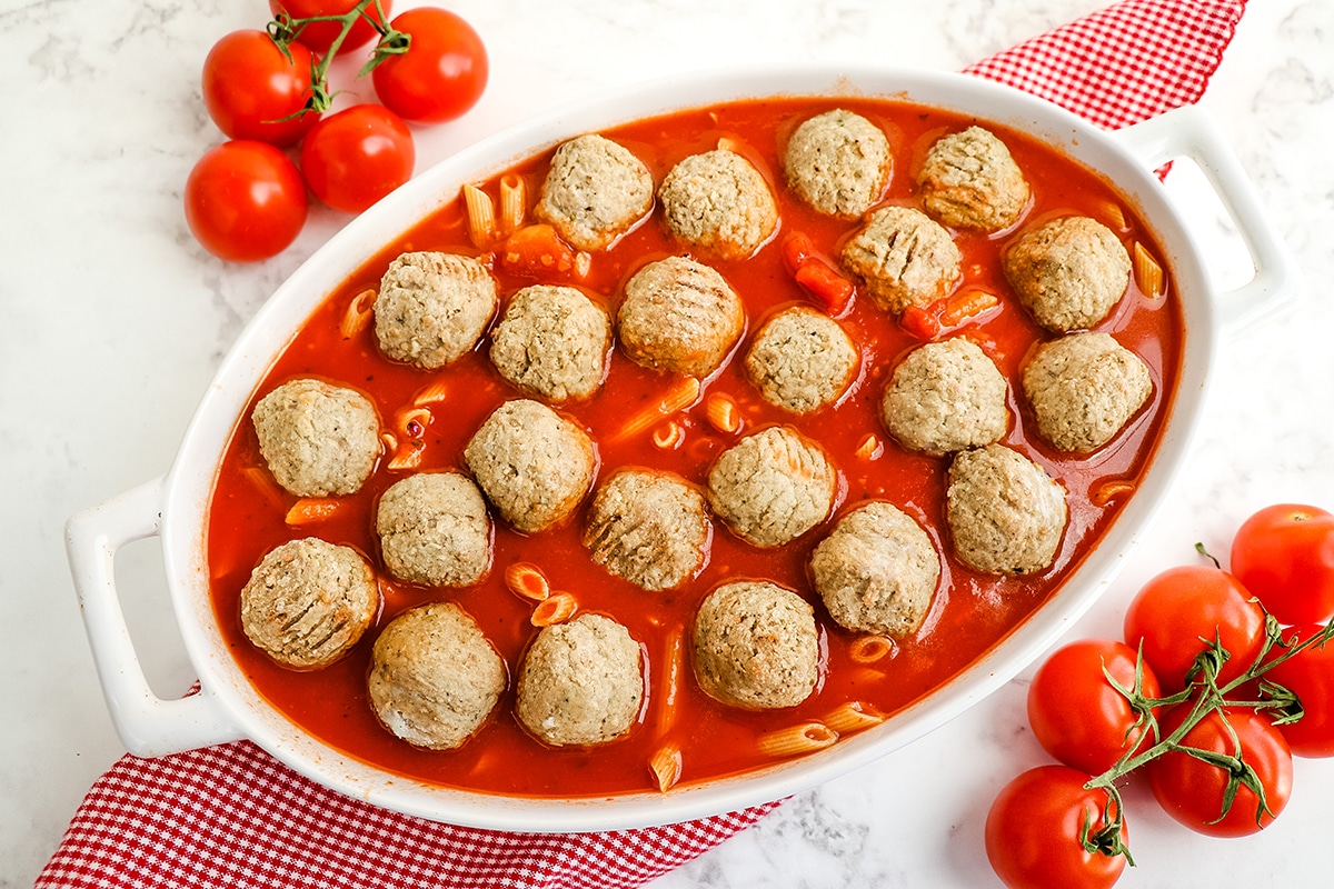 meatballs on top of sauce and pasta