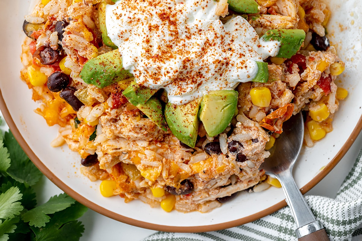 spoon in plate of mexican casserole