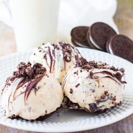 three mini oreo cheesecakes on a plate