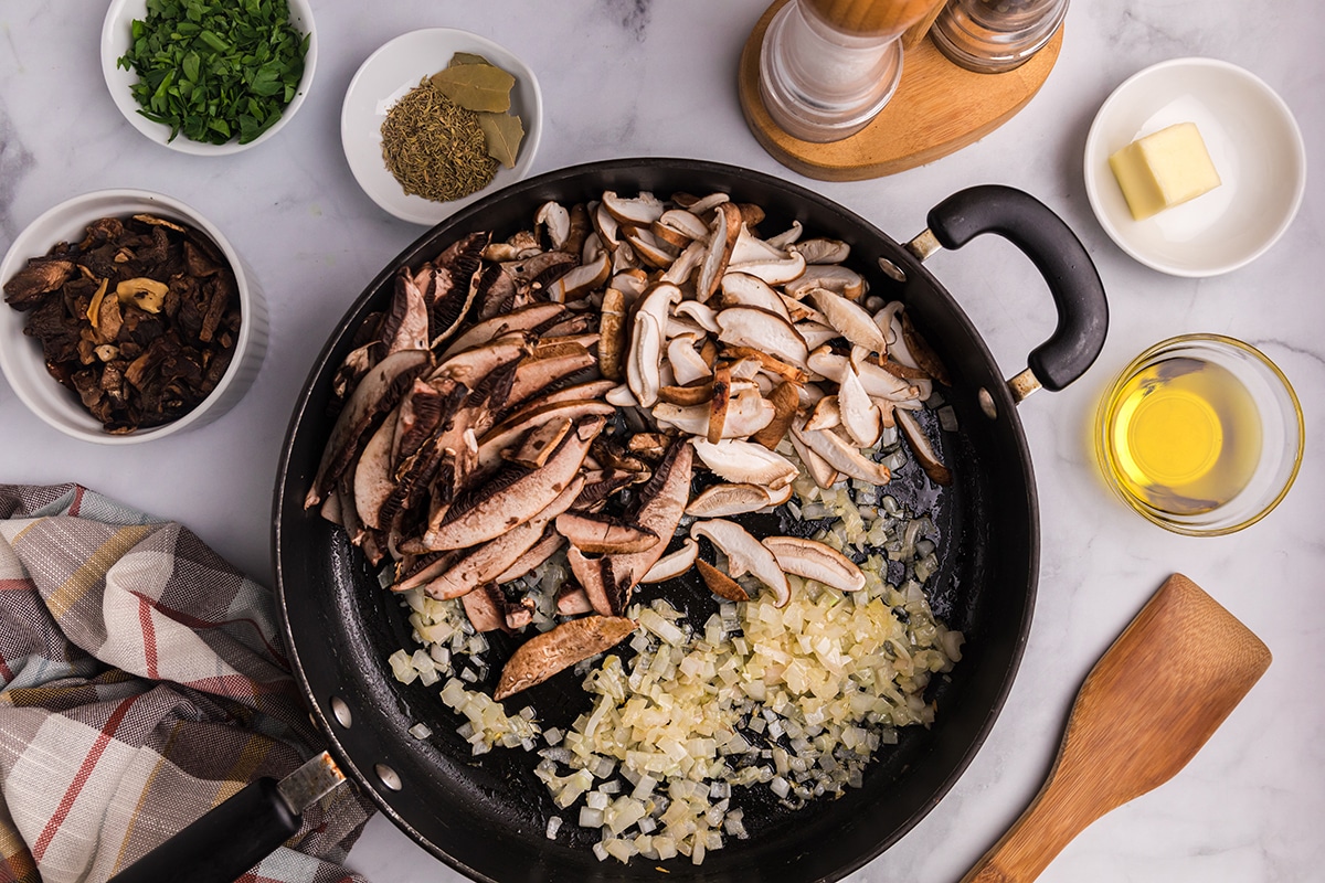 mushrooms and onions in a skillet