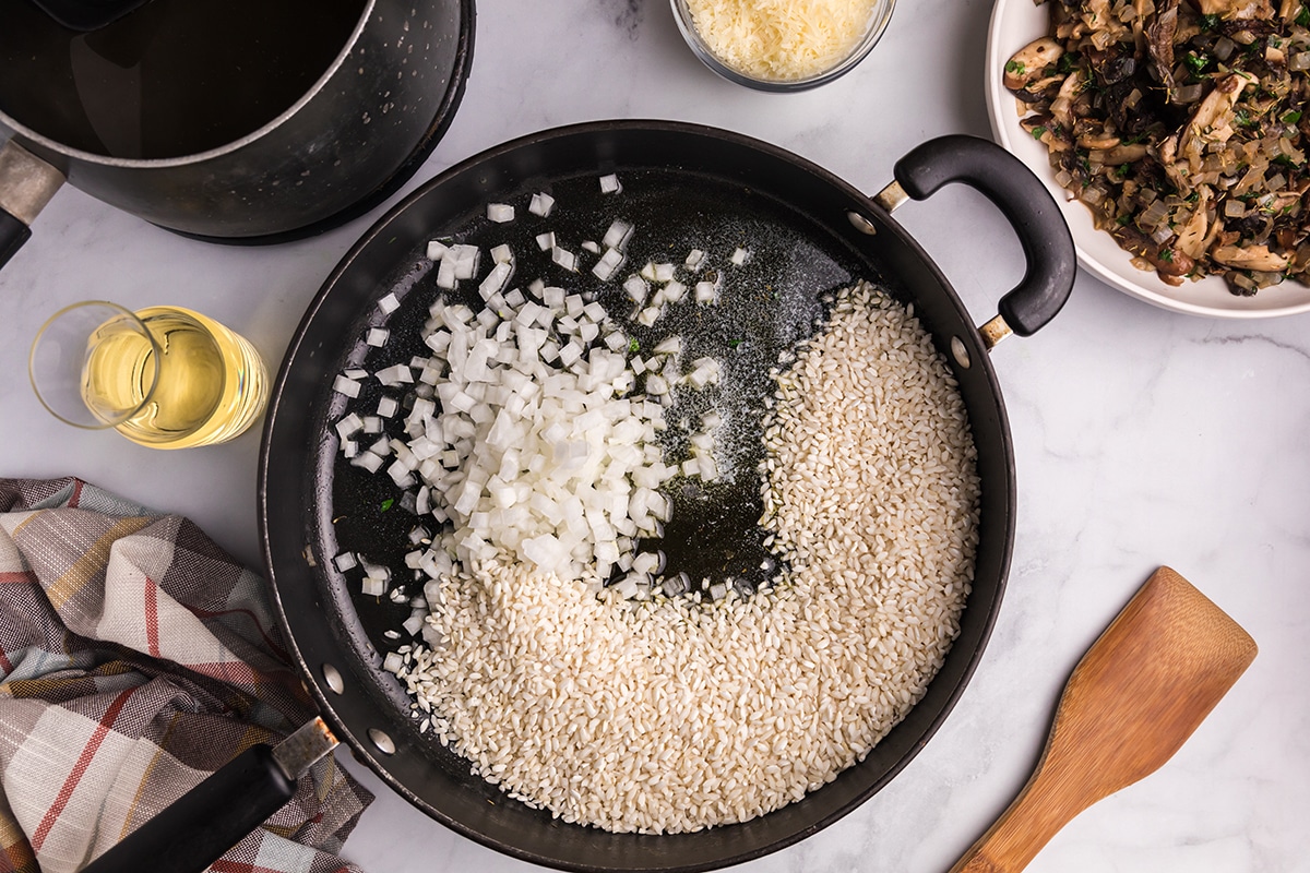 rice and onions in skillet