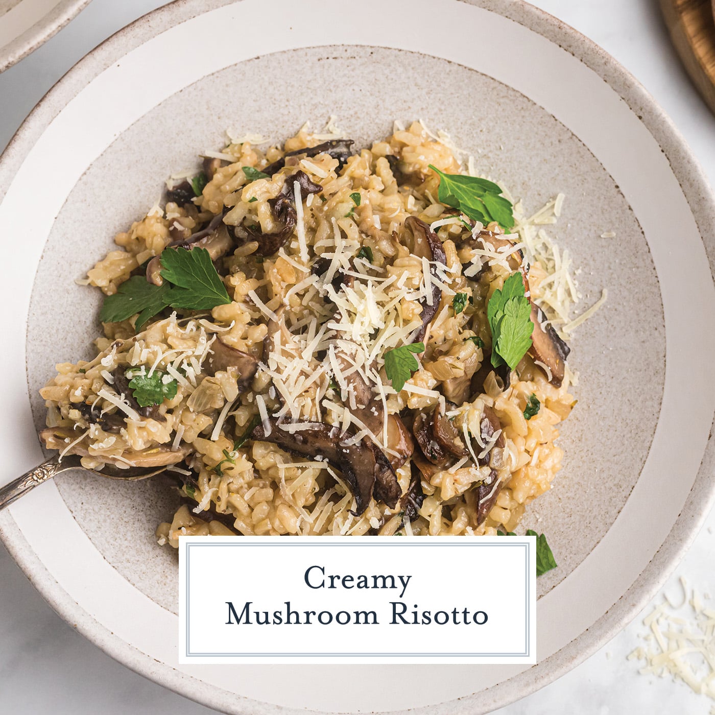 overhead shot of plate of mushroom risotto with text overlay for facebook