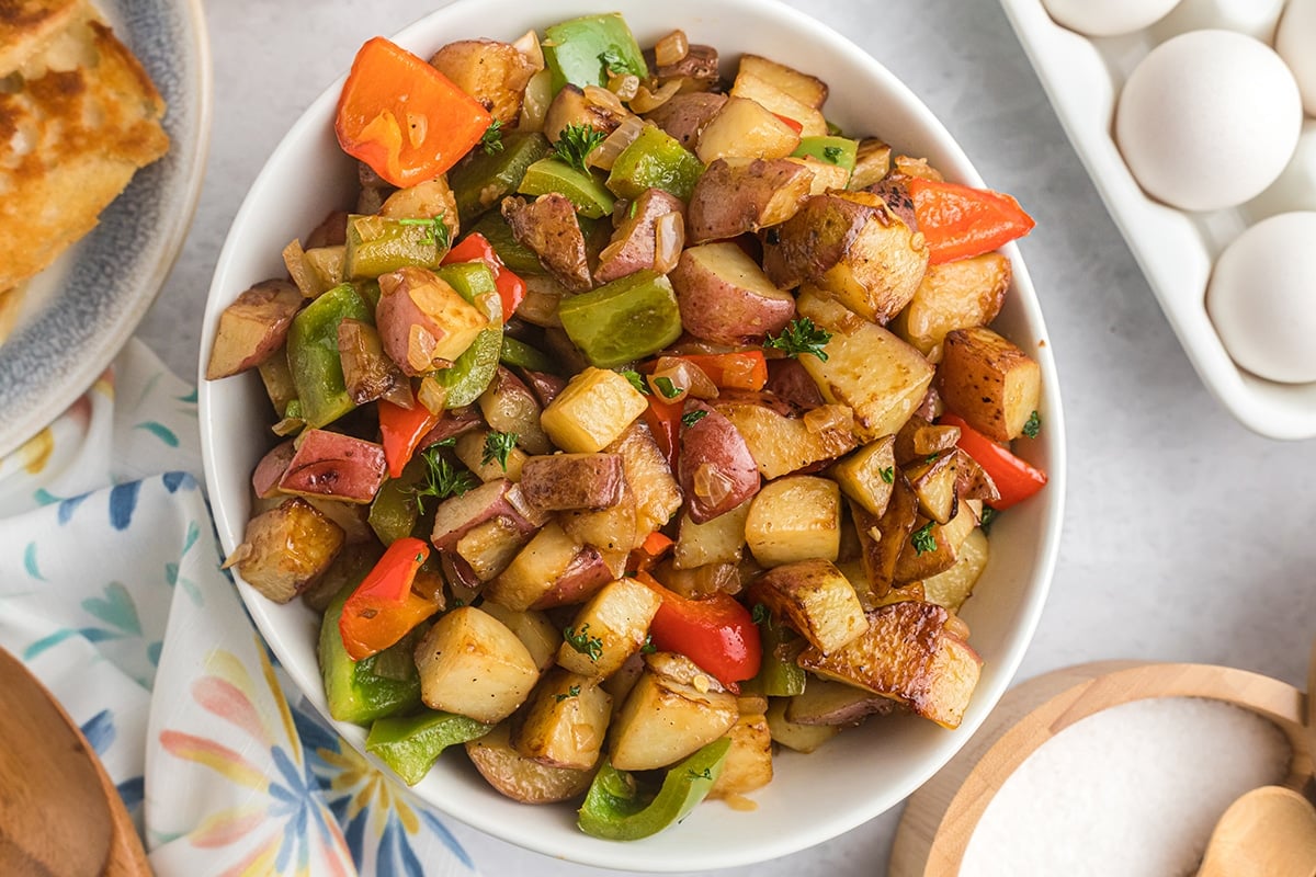 close up of bowl of potatoes o'brien